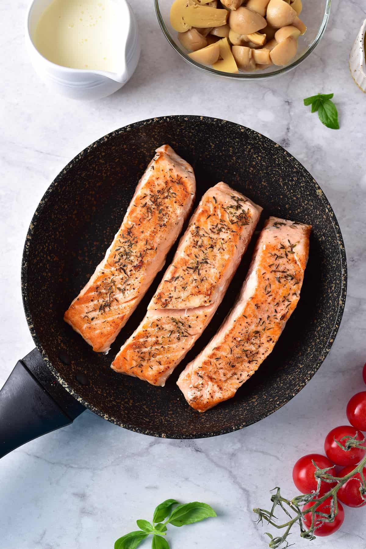 Pan fried salmon flipped over.