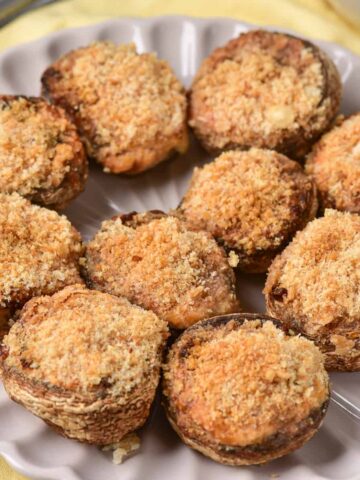 Close up of air fryer stuffed mushrooms on a plate.