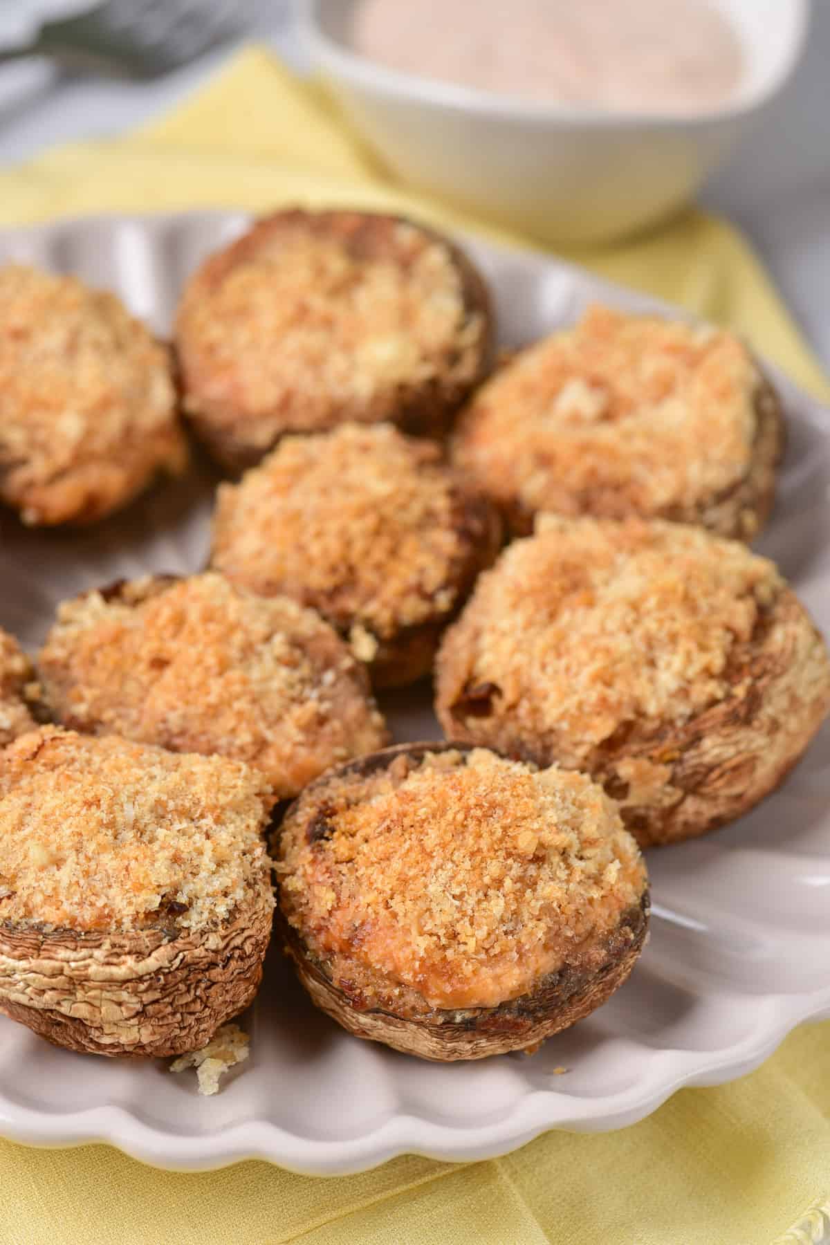 Plate of air fryer stuffed mushrooms with breadcrumb topping.