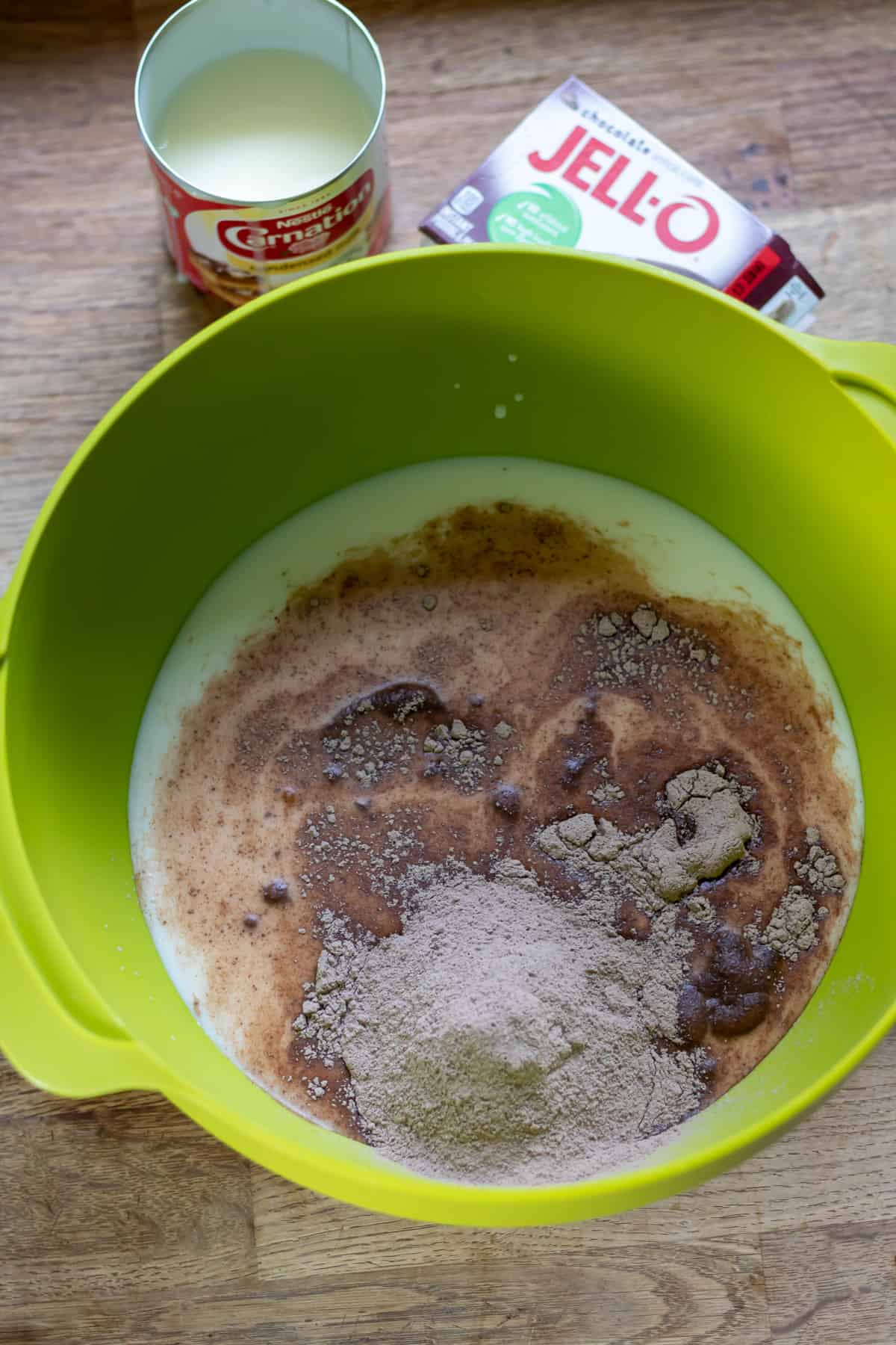 Pudding mix, condensed milk and milk in a mixing bowl.